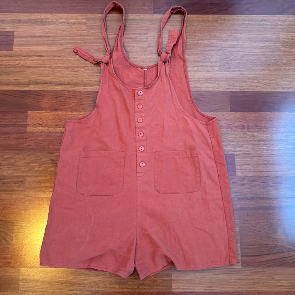 Rust color romper with pockets and adjustable straps